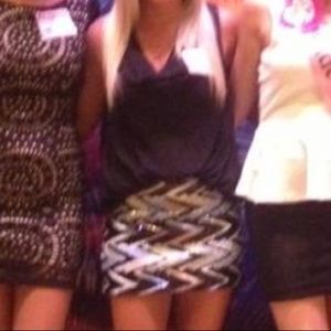 Black sleeveless dress with sequin skirt